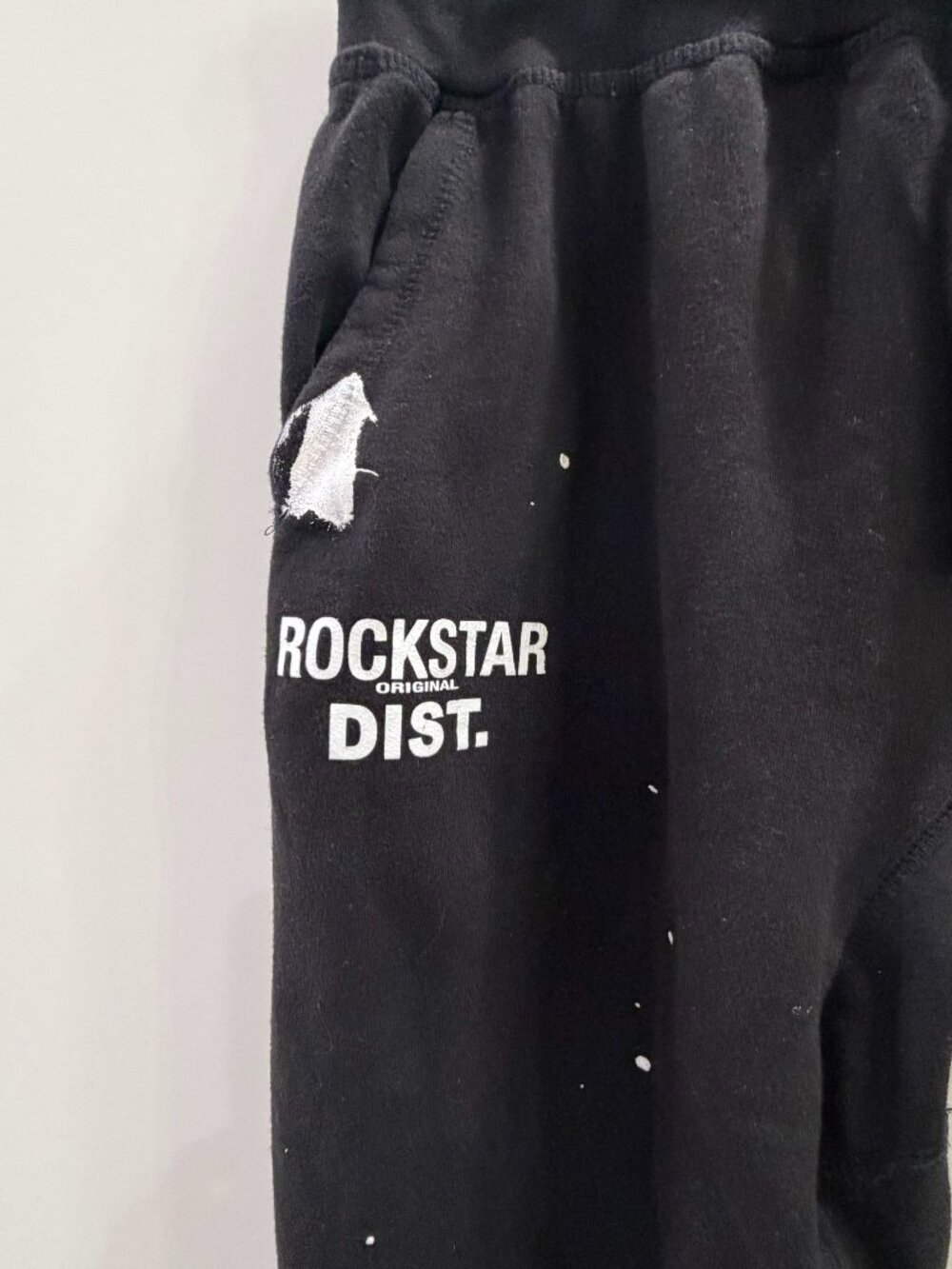 Rockstar Original men's black flared sweatpants drawstring white paint splatter